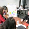 attendees work on leadership with post-it notes
