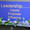 A board that reads 'Leadership... Inspire, Empower, Influence"